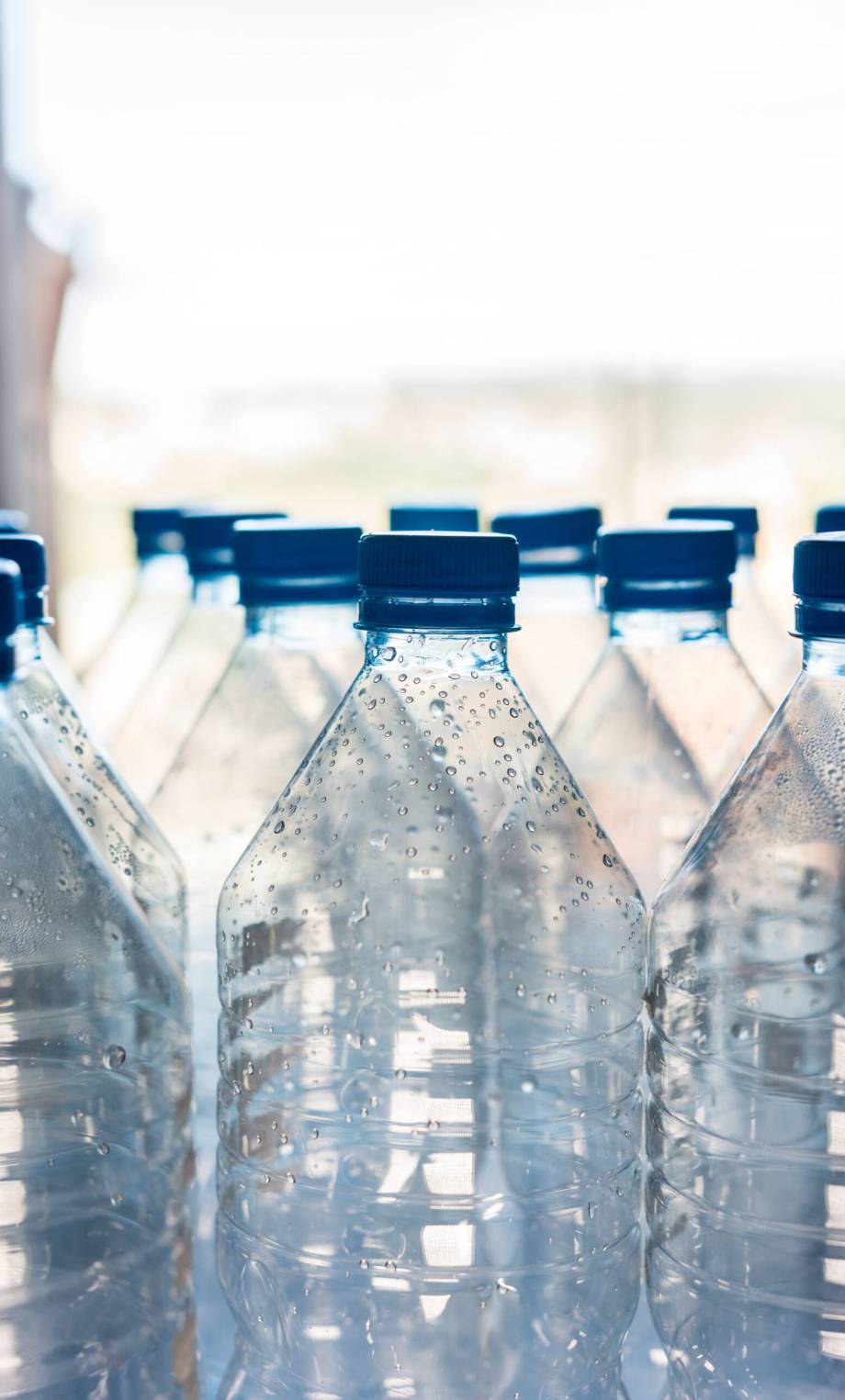 several-plastic-bottles-ready-be-recycled-min